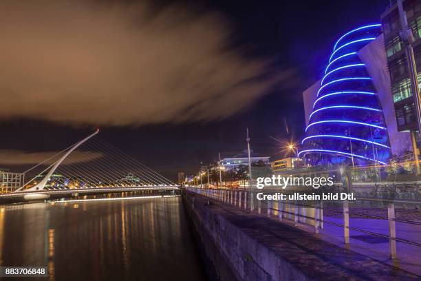 Long exposure picture of the Samuel Beckett Bridge over the river Liffey and The Convention Center Dublin in Dublin, Ireland, 19 August 2015.