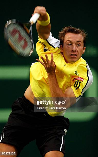 Philipp Kohlschreiber of Germany serves during his first round match against Bjoern Phau of Germany on day 2 of the Gerry Weber Open at the Gerry...
