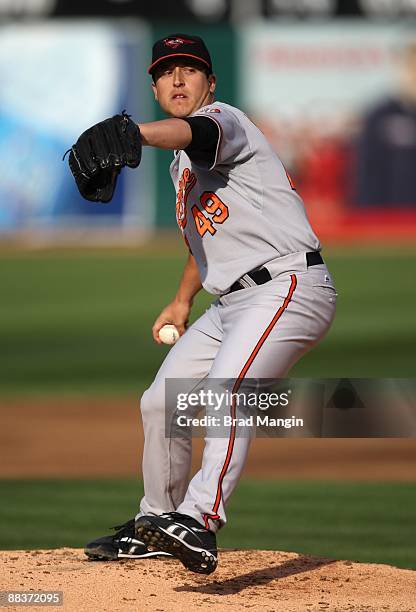 Jason Berken of the Baltimore Orioles pitches during the game against the Oakland Athletics at the Oakland-Alameda County Coliseum on June 6, 2009 in...