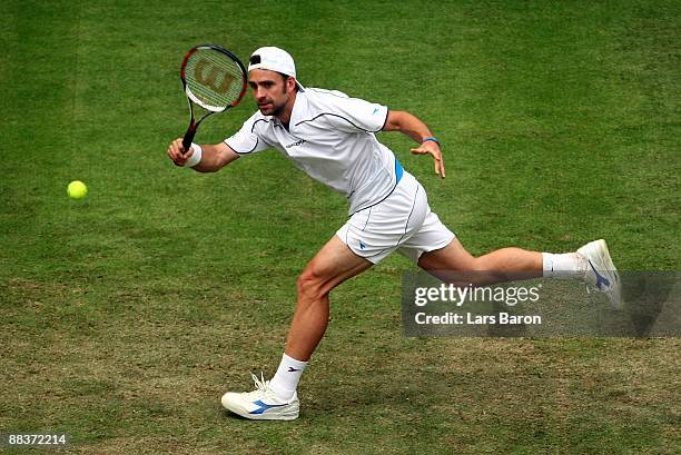 Nicolas Kiefer of Germany plays a forehand during his first round match against Viktor Troicki of Serbia on day 2 of the Gerry Weber Open at the...