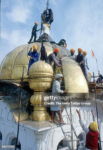 Repairs begin at the Golden Temple after the operation in 1984 in Amritsar, India.