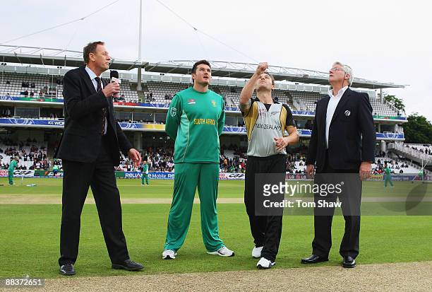 Brendon McCullum of New Zealand tosses the coin watched by Graeme Smith of South Africa, commentator Jeremy Coney and match referee Alan Hurst during...