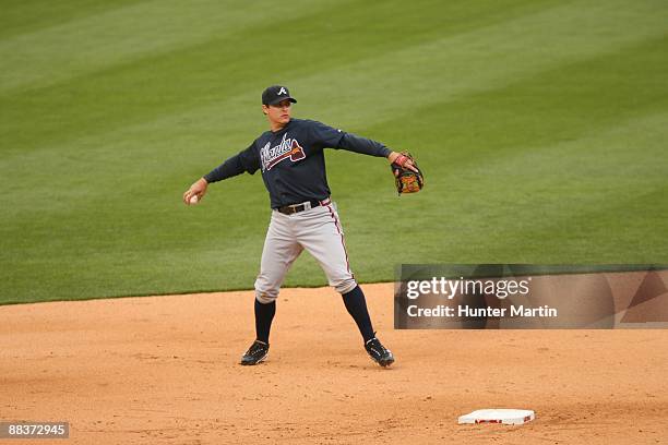 Second baseman Kelly Johnson of the Atlanta Braves throws to first base during a game against the Philadelphia Phillies at Citizens Bank Park on...