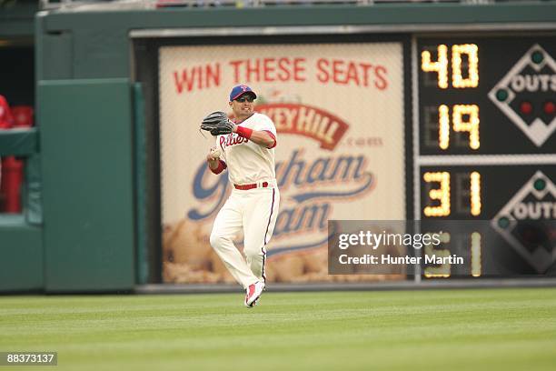 Center fielder Shane Victorino of the Philadelphia Phillies throws to the infield during a game against the Atlanta Braves at Citizens Bank Park on...