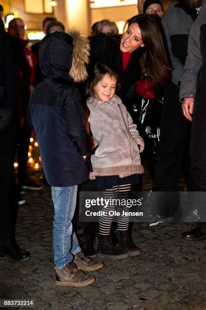 Princess Marie of Denmark and her children Princess Athena and Prince Henrik lights a candle in remembrance of World AIDS Day at Gammel Torv on...