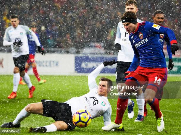 Kirill Nababkin of PFC CSKA Moscow vies for the ball with Maksim Paliyenko of FC Tosno Saint Petersburg during the Russian Premier League match...