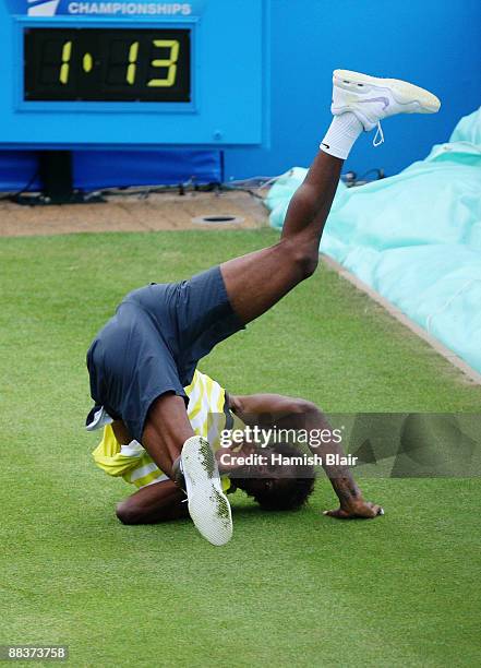 Gael Monfils of France takes a tumble during the men's second round match against Andrey Golubev of Kazakhstan during Day 2 of the the AEGON...