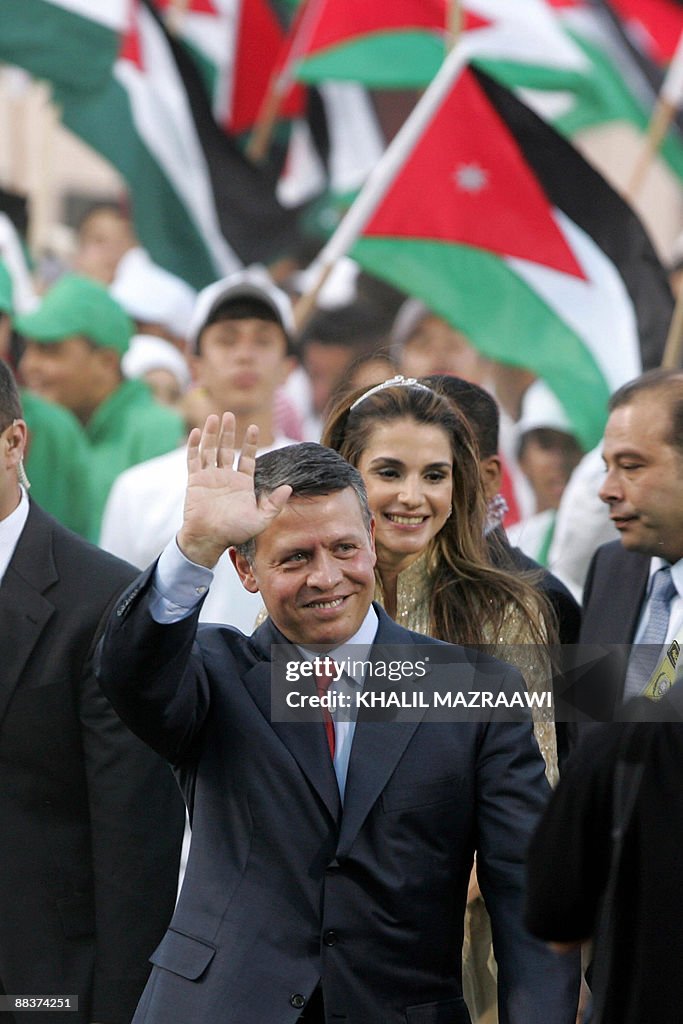 Jordan's King Abdullah II waves to the c