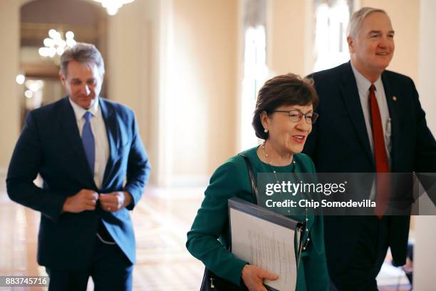 Sen. Jeff Flake , Sen. Susan Collins and Sen. Luther Strange head for the Senate floor at the U.S. Capitol December 1, 2017 in Washington, DC. Senate...