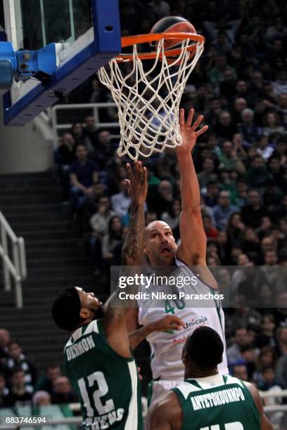 James Augustine, #40 of Unicaja Malaga competes with Marcus Denmon, #12 of Panathinaikos Superfoods Athens during the 2017/2018 Turkish Airlines...