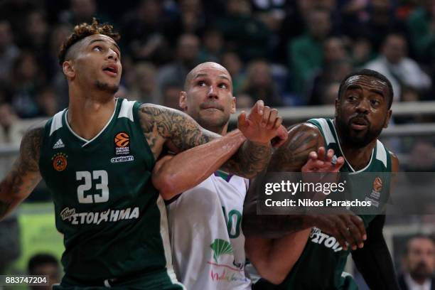James Augustine, #40 of Unicaja Malaga competes with Zach Auguste, #23 and K. C. Rivers, #3 of Panathinaikos Superfoods Athens during the 2017/2018...