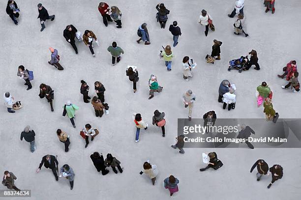shot of many pedestrians from above. - above stock pictures, royalty-free photos & images