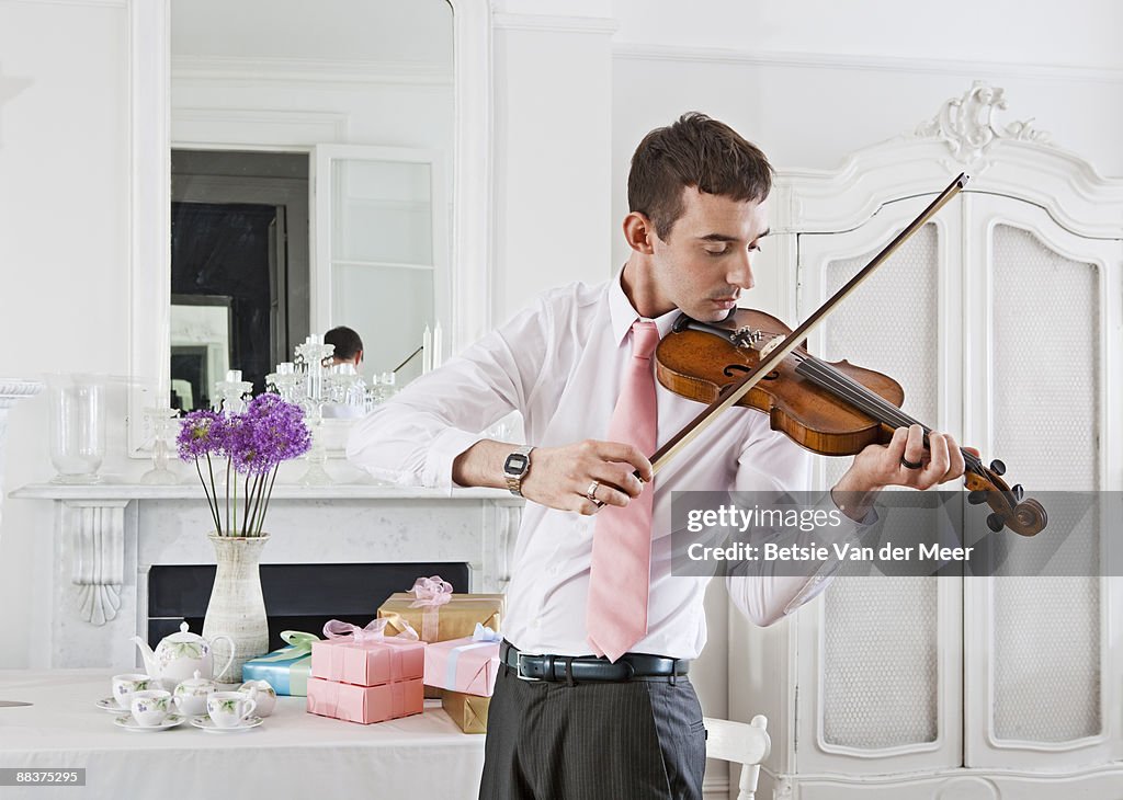 Man playing violin.