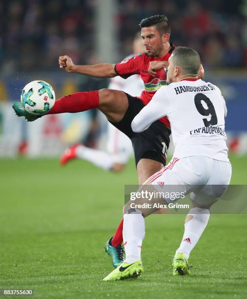 Marco Terrazzino of Freiburg is challenged by Kyriakos Papadopoulos of Hamburg during the Bundesliga match between Sport-Club Freiburg and Hamburger...