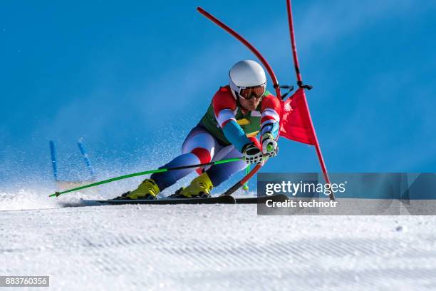 front view of professional alpine skier compeeting at giant slalom race - ski slalom imagens e fotografias de stock