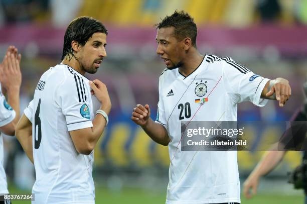 Deutschland - Portugal Diskussion nach dem Abpfiff: Sami Khedira und Jerome Boateng