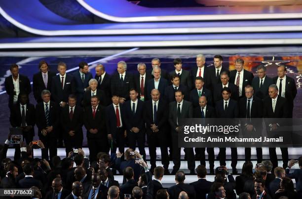 The national team managers pose for a photo during the Final Draw for the 2018 FIFA World Cup Russia at the State Kremlin Palace on December 1, 2017...