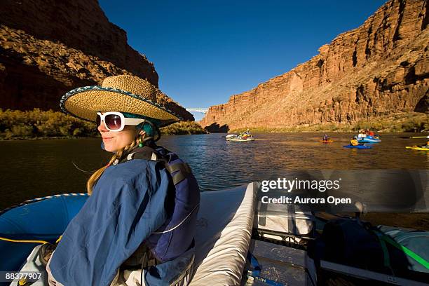 a woman on a raft in the grand canyon, arizona. - grand canyon rafting stock pictures, royalty-free photos & images