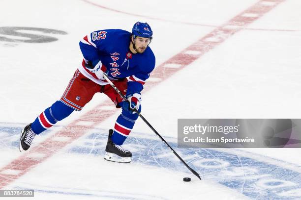 New York Rangers Defenceman Brendan Smith skates across center ice during the first period of a regular season NHL game between the Detroit Red Wings...