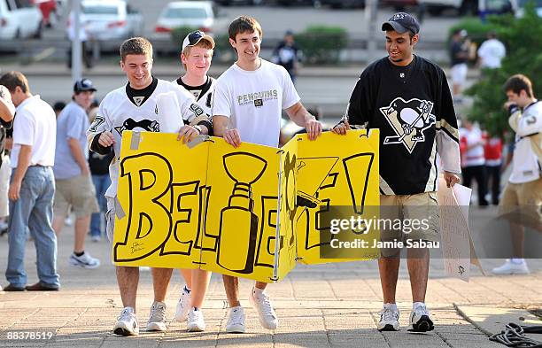 Pittsburgh fans walk to Mellon Arena before the Detroit Red Wings face the Pittsburgh Penguins during Game Six of the NHL Stanley Cup Finals on June...