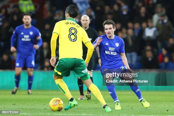 Mario Vrancic of Norwich City is marked by Craig Bryson of Cardiff City during the Sky Bet Championship match between Cardiff City and Norwich City...