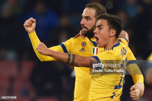 Gonzalo Higuain of Juventus celebrates With Paulo Dybala after scoring the opening goal during the Serie A match between SSC Napoli and Juventus at...