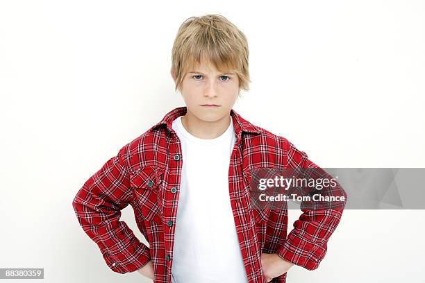 little boy (10-11), hands on hips, portrait - boy 10 11 stock pictures, royalty-free photos & images