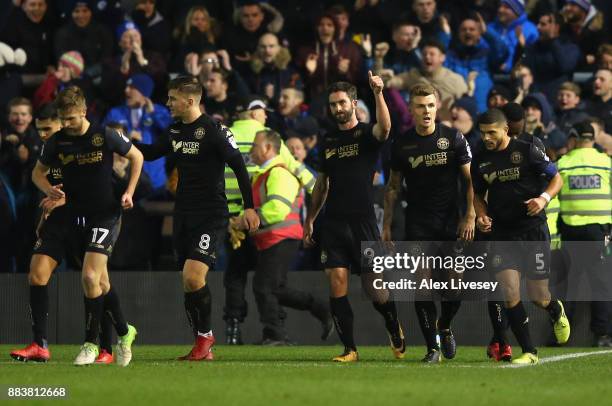 Will Grigg of Wigan Athletic celebrates after scoring the opening goal during The Emirates FA Cup Second Round between AFC Fylde and Wigan Athletic...