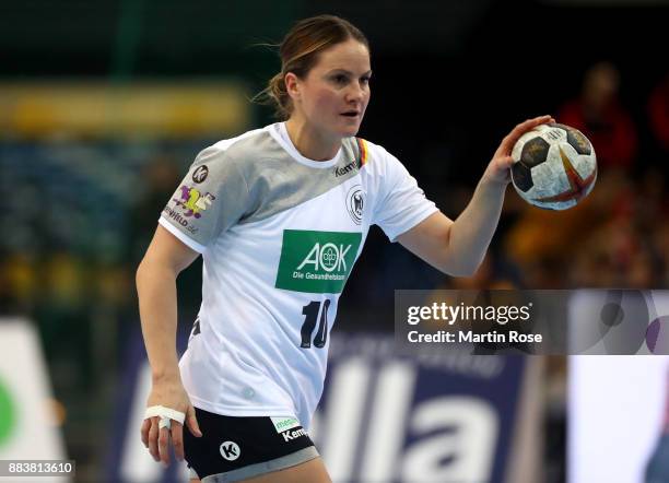 Anna Loerper of Germany controls the ball during the IHF Women's Handball World Championship group D match between Germany and Cameroon at Arena...