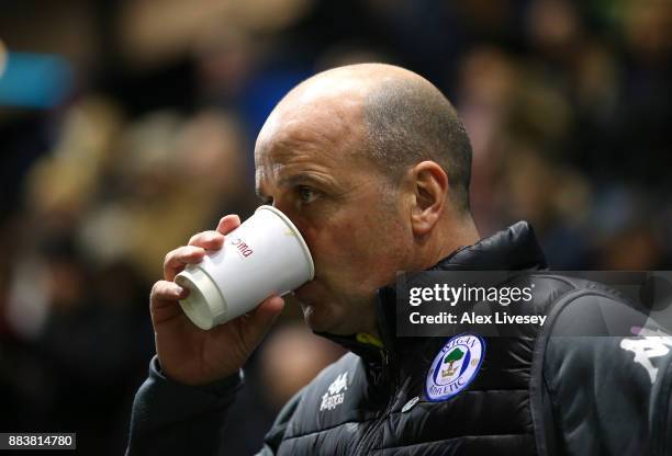 Paul Cook the manager of Wigan Athletic looks on during The Emirates FA Cup Second Round between AFC Fylde and Wigan Athletic on December 1, 2017 in...