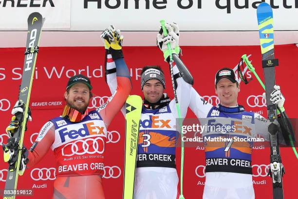 Kjetil Jansrud of Norway, Vincent Kriechmayr of Austria and Hannes Reichelt of Austria poses for photographers on the medals podium after the Men's...