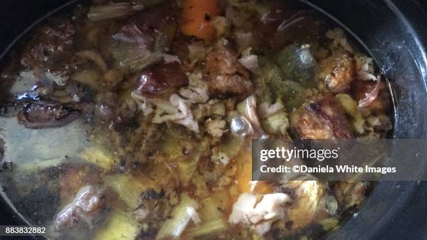 making beef bone broth - bone broth stock pictures, royalty-free photos & images