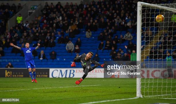 Norwich goalkeeper Angus Gunn is beaten by a shot from Junior Hoilett for the second Cardiff goal during the Sky Bet Championship match between...
