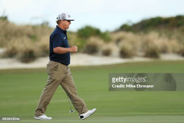 Charley Hoffman of the United States reacts to his birdie on the 18th green during the second round of the Hero World Challenge at Albany, Bahamas on...