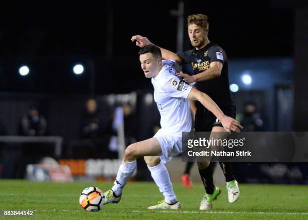 Michael Jacobs of Wigan Athletic and George Edmundson of AFC Fylde in action during The Emirates FA Cup Second Round match between AFC Fylde and...