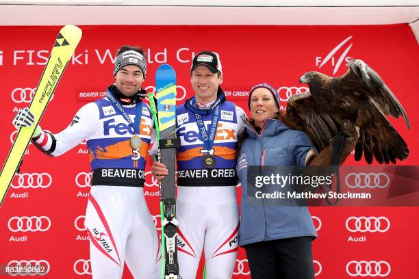 Vincent Kriechmayr and Hannes Reichelt of Austria pose for photographers on the medals podium after the Men's Super-G during the Audi Birds of Prey...