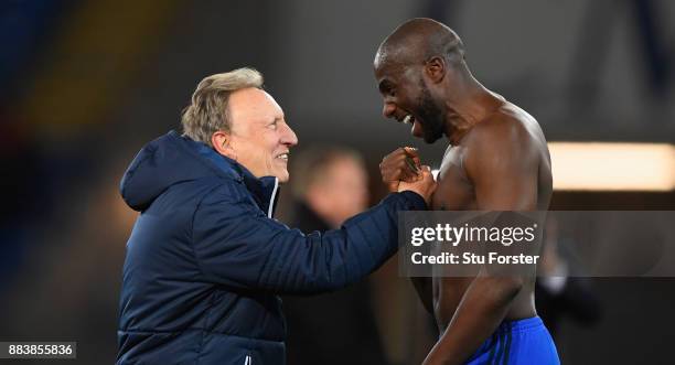 Cardiff manager Neil Warnock celebrates with defender Sol Bamba after the Sky Bet Championship match between Cardiff City and Norwich City at Cardiff...