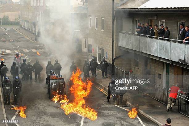 Britain's Prince Charles is given a demonstration by riot police of the Territorial Support Group at the Metropolitan Police Specialist Training...