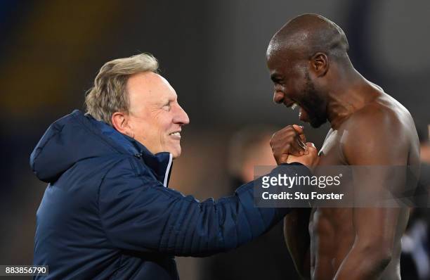 Cardiff manager Neil Warnock celebrates with defender Sol Bamba after the Sky Bet Championship match between Cardiff City and Norwich City at Cardiff...