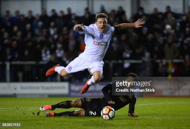 Sam Finley of AFC Fylde is awarded a penalty after Nathan Byrne of Wigan Athletic miss times his tackle during The Emirates FA Cup Second Round match...