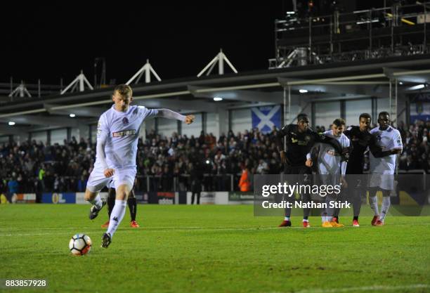 Danny L. Rowe of AFC Fylde scores a penality during The Emirates FA Cup Second Round match between AFC Fylde and Wigan Athletic on December 1, 2017...