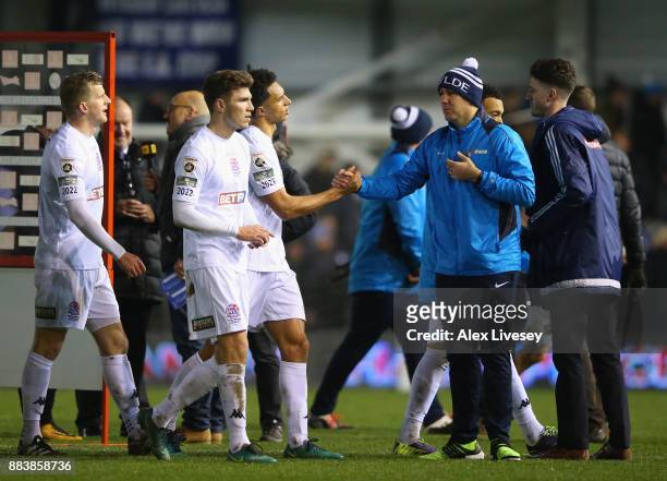 Dave Challinor the manager of AFC Fylde congratulates his players after The Emirates FA Cup Second Round between AFC Fylde and Wigan Athletic on...