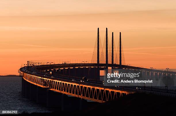 oresund bridge between sweden and denmark - oresund region stock-fotos und bilder