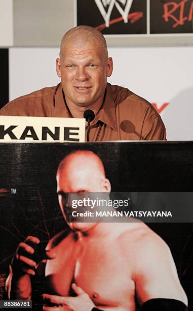 World Wrestling Entertainment wrestler Kane poses during a promotional event in New Delhi on June 10, 2009. WWE's business focus is on professional...