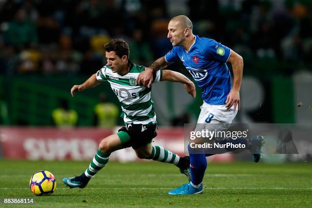 Sporting's forward Daniel Podence vies for the ball with Belenenses's midfielder Andre Sousa during Primeira Liga 2017/18 match between Sporting CP...