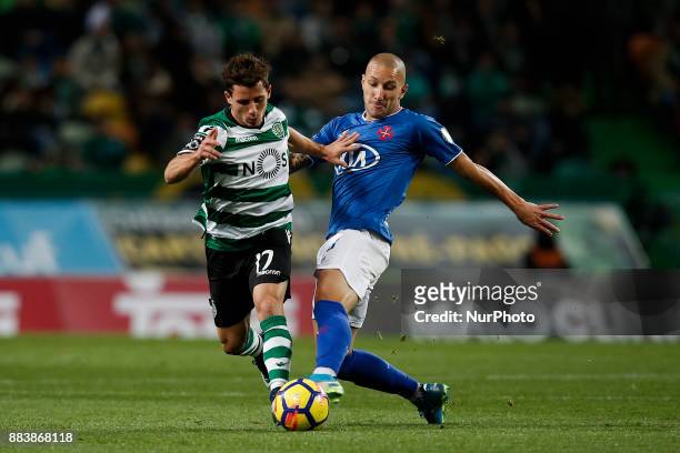 Sporting's forward Daniel Podence vies for the ball with Belenenses's midfielder Andre Sousa during Primeira Liga 2017/18 match between Sporting CP...