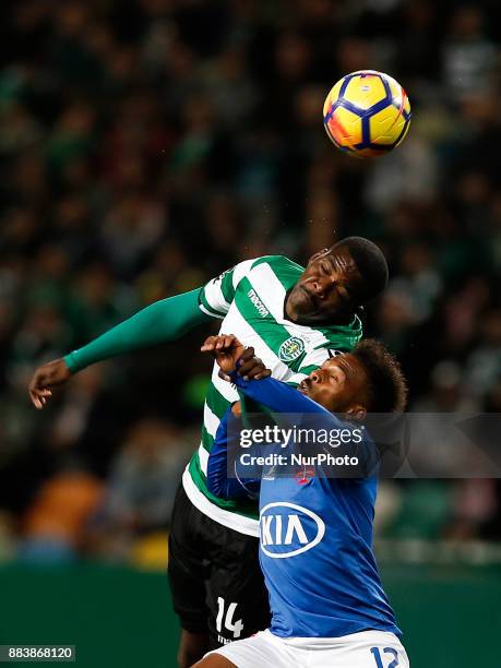 Sporting's midfielder William Carvalho vies for the ball with Belenenses's forward Fredy during Primeira Liga 2017/18 match between Sporting CP vs CF...