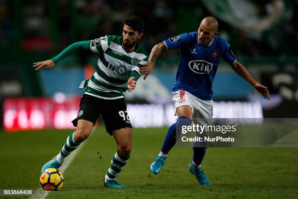 Sporting's defender Cristiano Piccini vies for the ball with Belenenses's midfielder Andre Sousa during Primeira Liga 2017/18 match between Sporting...