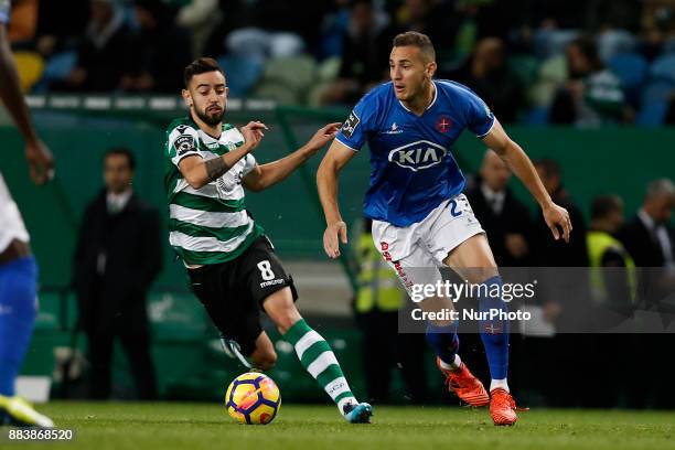 Sporting's midfielder Bruno Fernandes vies for the ball with Belenenses's midfielder Hassan Yebda during Primeira Liga 2017/18 match between Sporting...