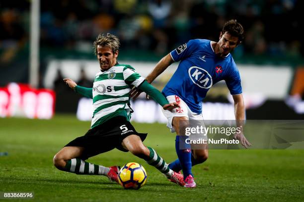 Sporting's defender Fabio Coentrao vies for the ball with Belenenses's midfielder Bruno Pereirinha during Primeira Liga 2017/18 match between...